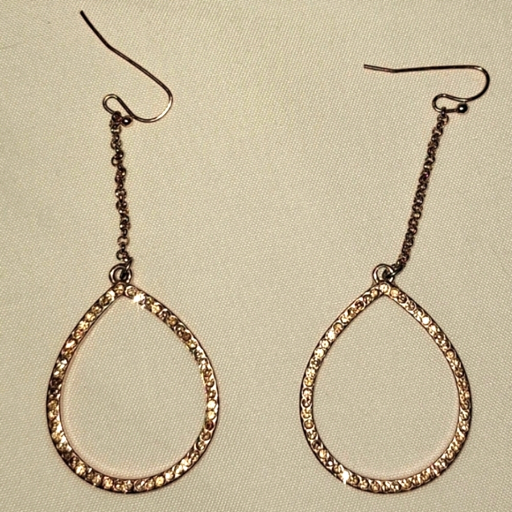 Rosegold tone open teardrop linear earring with champagne colored stones